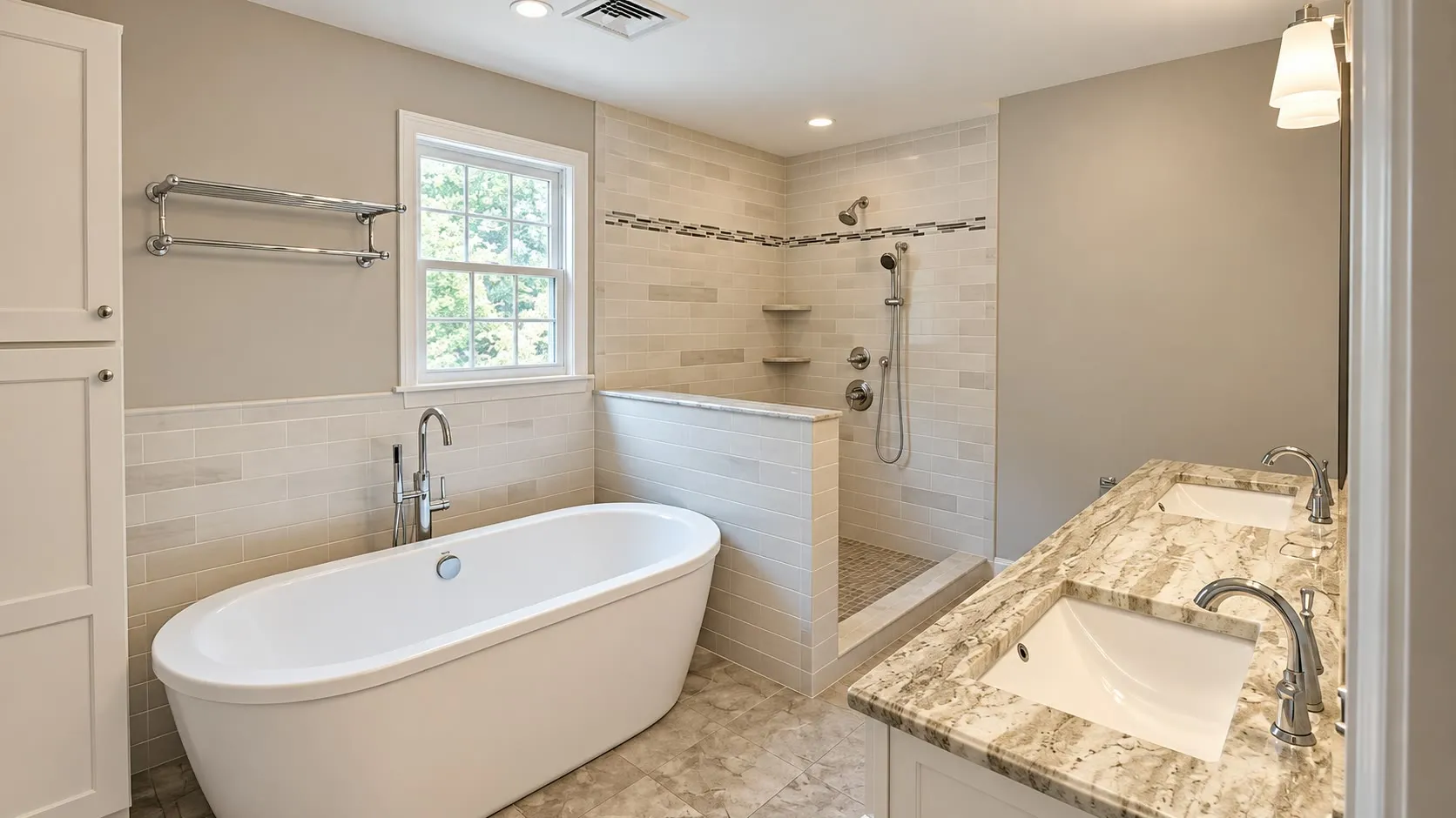 Taupe bathroom with a freestanding tub under a window, a half-wall walk-in shower with a mosaic accent band, and a granite vanity top with an undermount sink