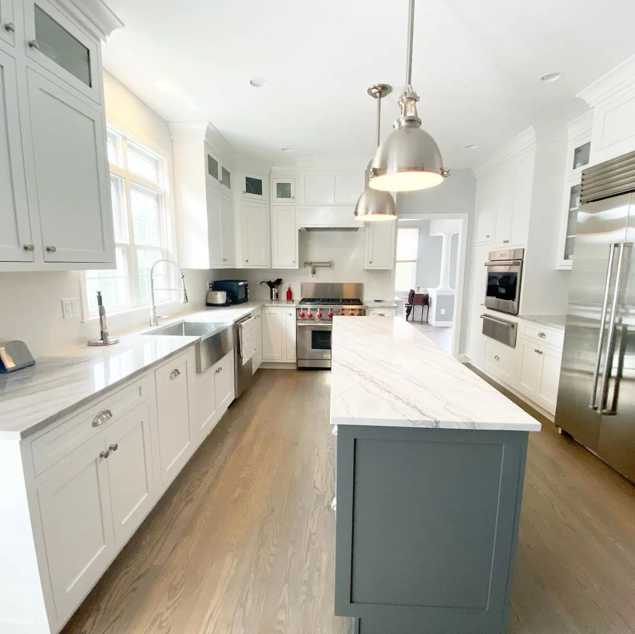 Cabinetry, countertop, and lighting selections brought together in a finished CJM Builders kitchen