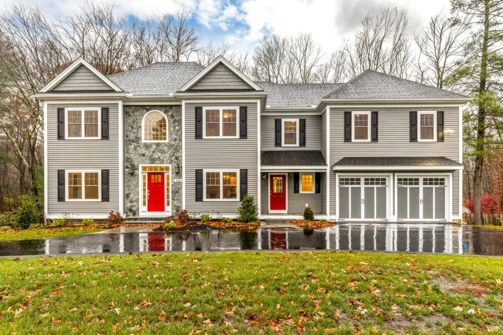 Gray siding, black shutters, and white trim on a CJM-built home in Reading, MA