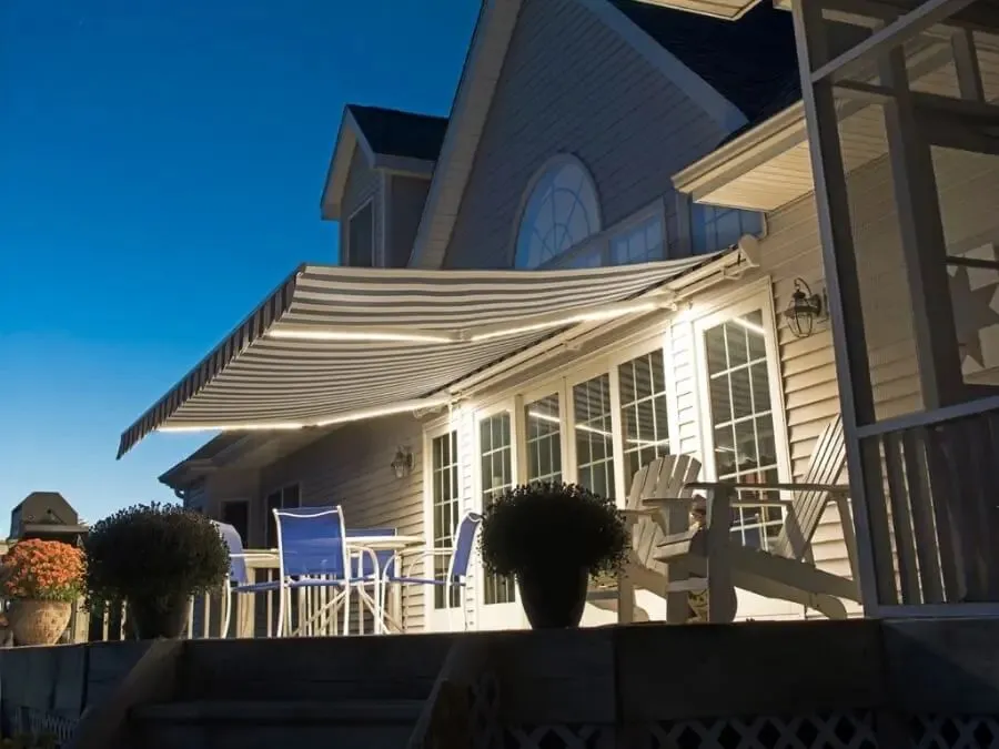 SunPro motorized retractable awning extended over a backyard deck