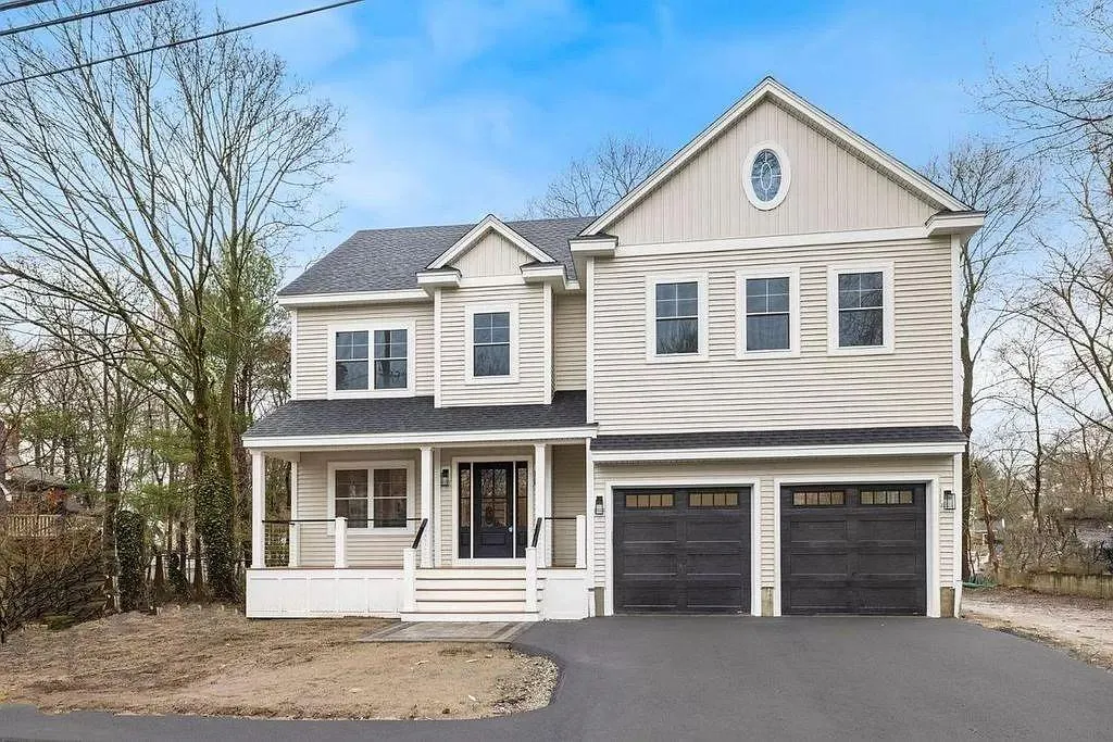 Craftsman-style home exterior with front porch and two-car garage